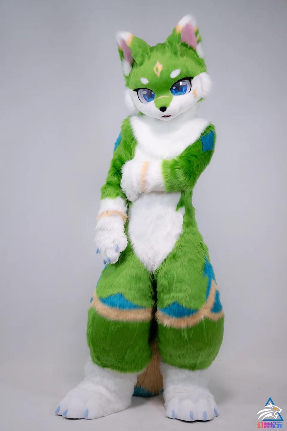 Green cat with blue and yellow tail, HUAN series, studio photograph