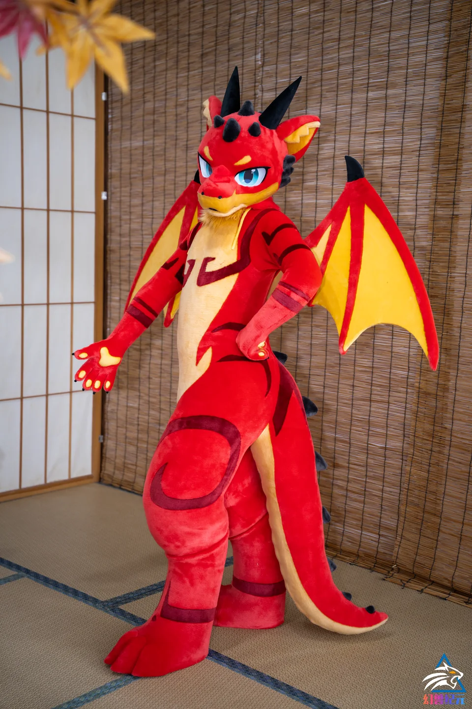 Red and yellow winged dragon with black spikes, LAN series, studio photograph