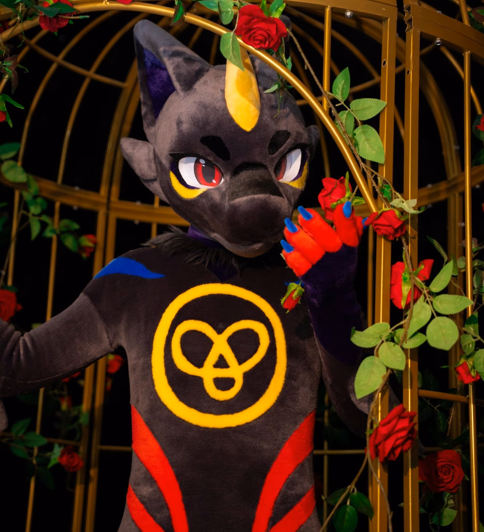 Dark NEOERA character among colorful plants